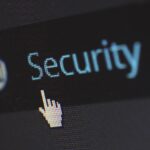 Decorative image representing cyber security showing cursor on a computer screen hovering over the word 'security'