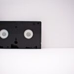 Black And White Vhs Tape On White Wooden Surface